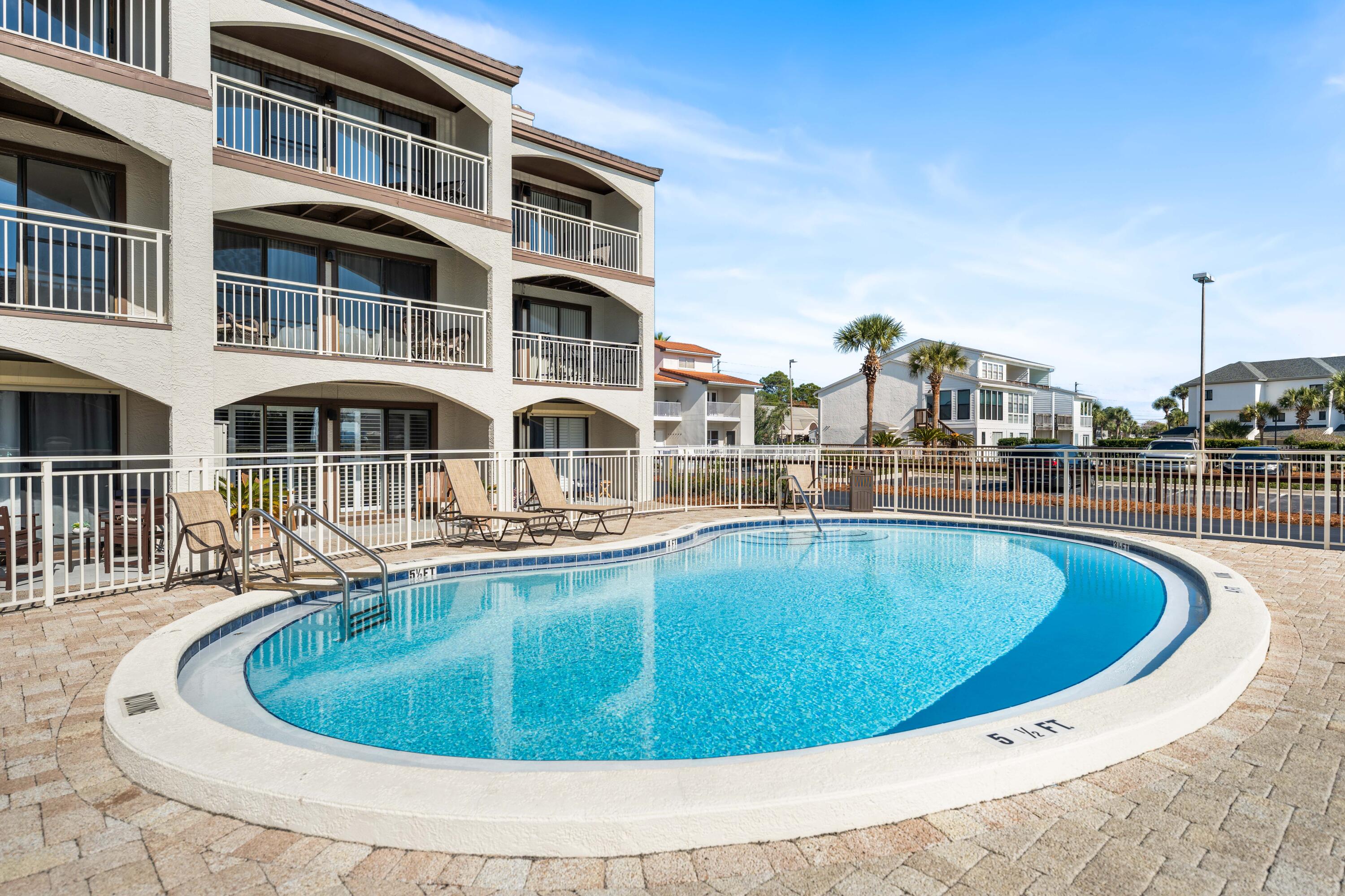 3654 East County Highway 30A, Unit 8B Santa Rosa Beach, FL 32459 - Photo 36 of 42 a view of a swimming pool with a house