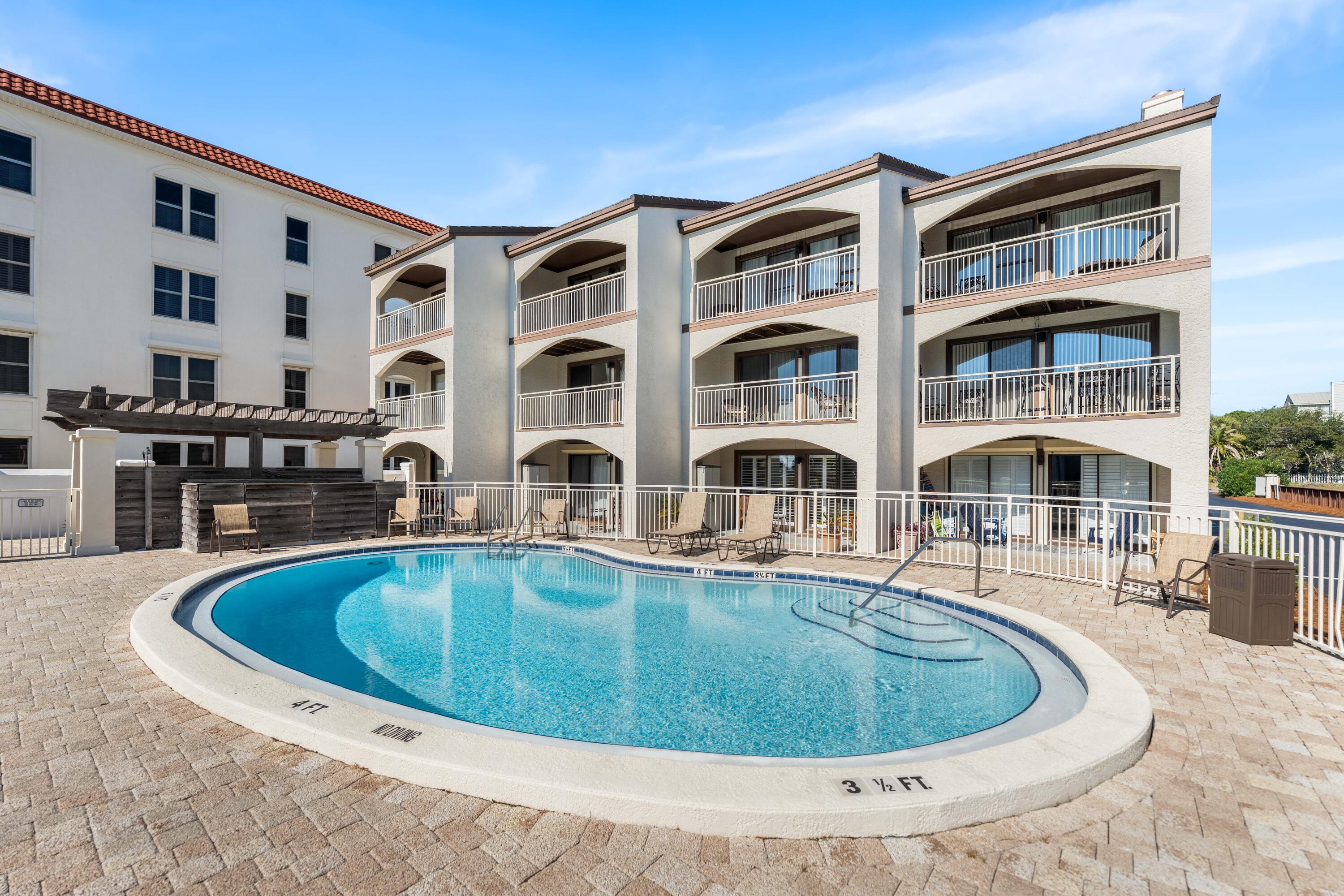 3654 East County Highway 30A, Unit 8B Santa Rosa Beach, FL 32459 - Photo 37 of 42 a view of residential house with swimming pool and seating