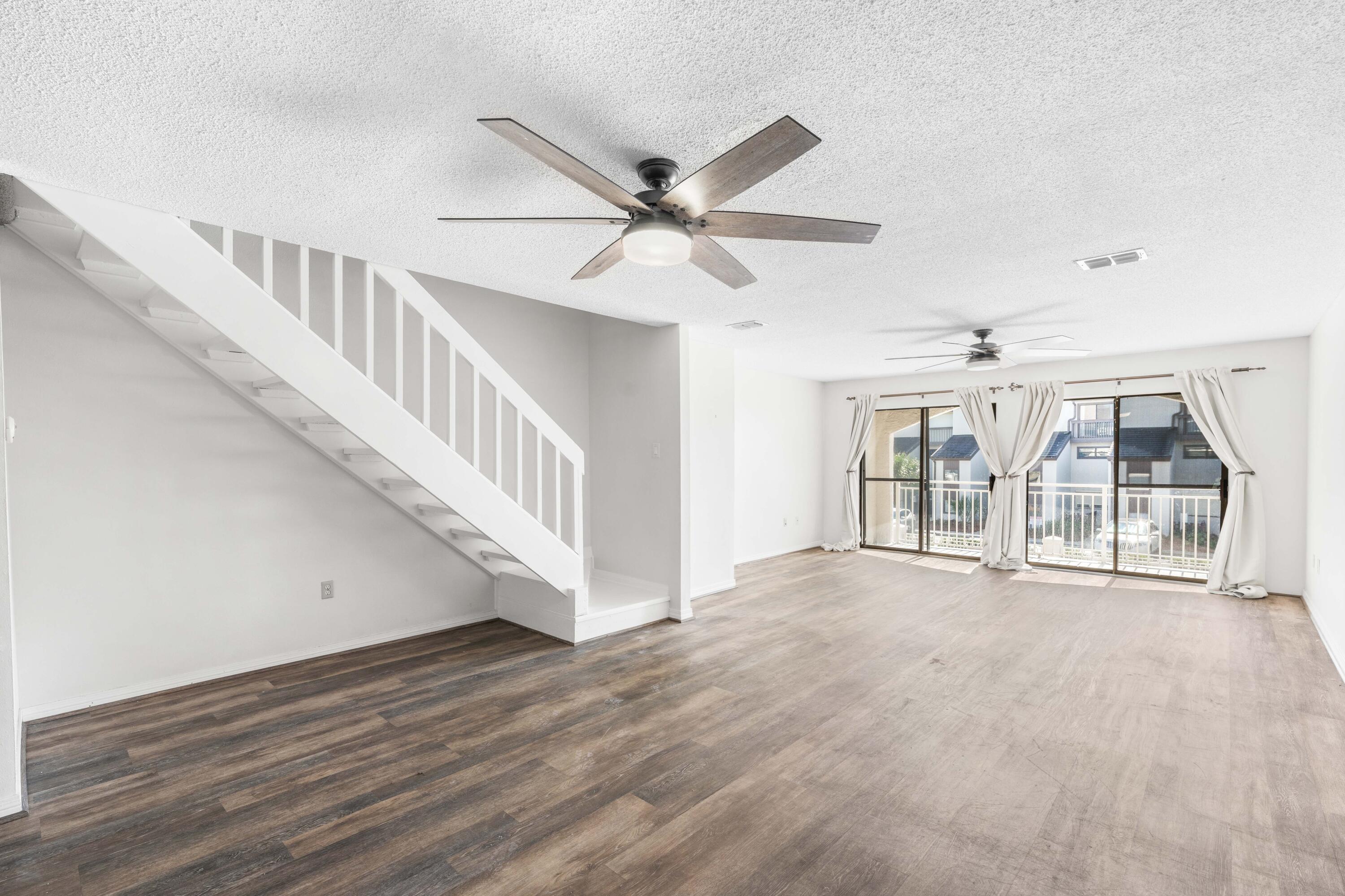 3654 East County Highway 30A, Unit 8B Santa Rosa Beach, FL 32459 - Photo 10 of 42 a view of an entryway with wooden floor
