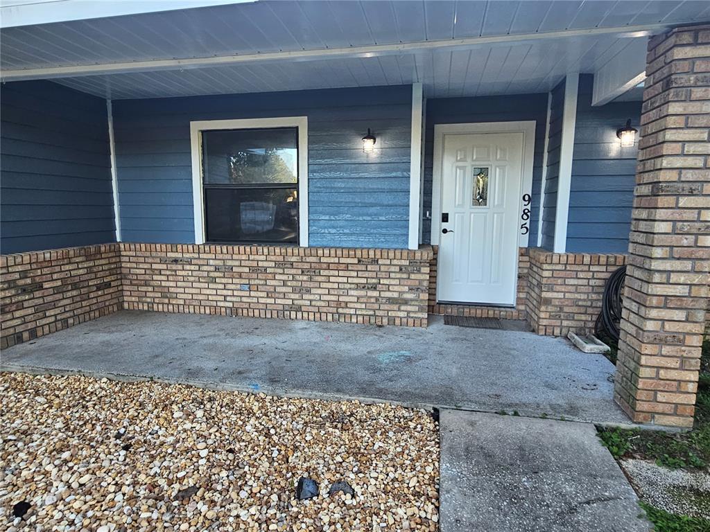 985 Southeast 56th Court Ocala, FL 34480 - Photo 3 of 36 a view of front door of house