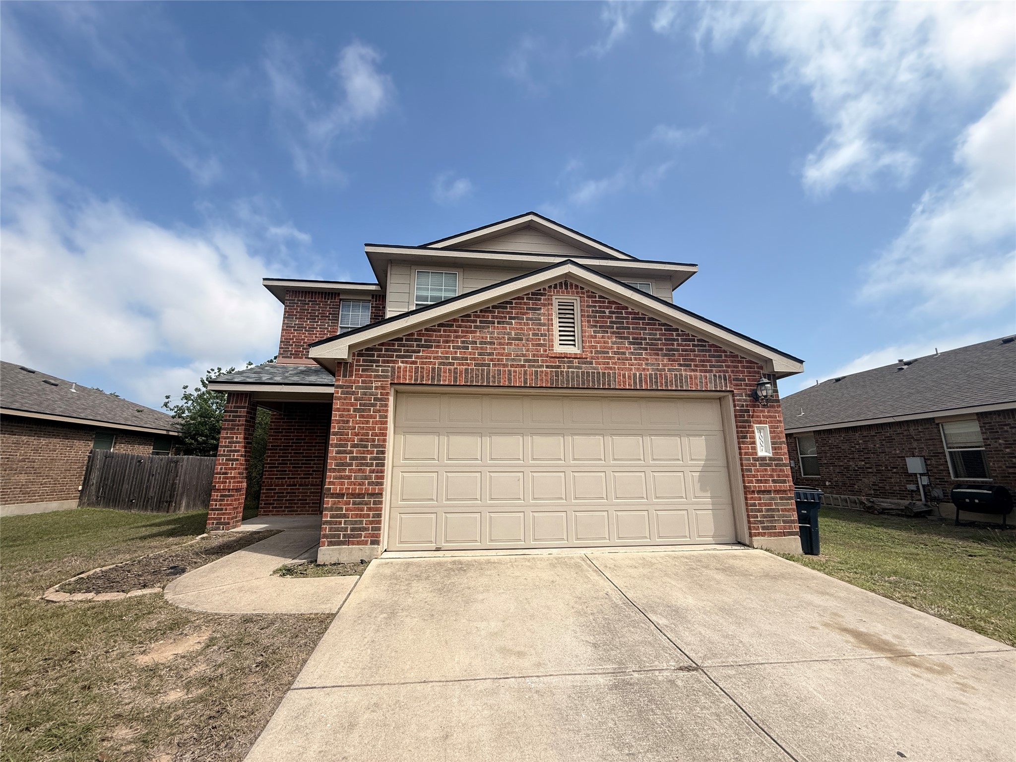 1007 Ranchero Road Leander, TX 78641 - Photo 1 of 1 a front view of a house with a yard and garage