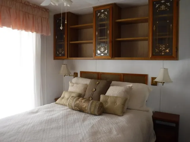 a bed room with a bed window and wall