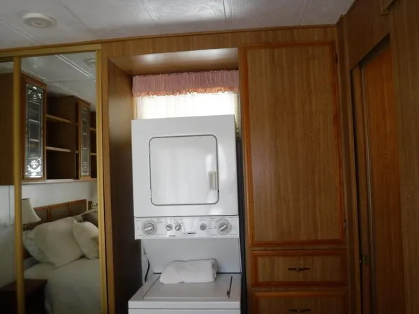 a bathroom with a toilet and a mirror