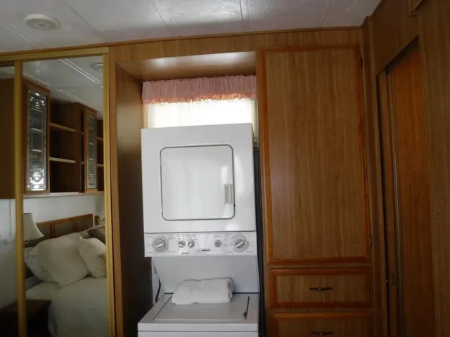 a bathroom with a toilet and a mirror