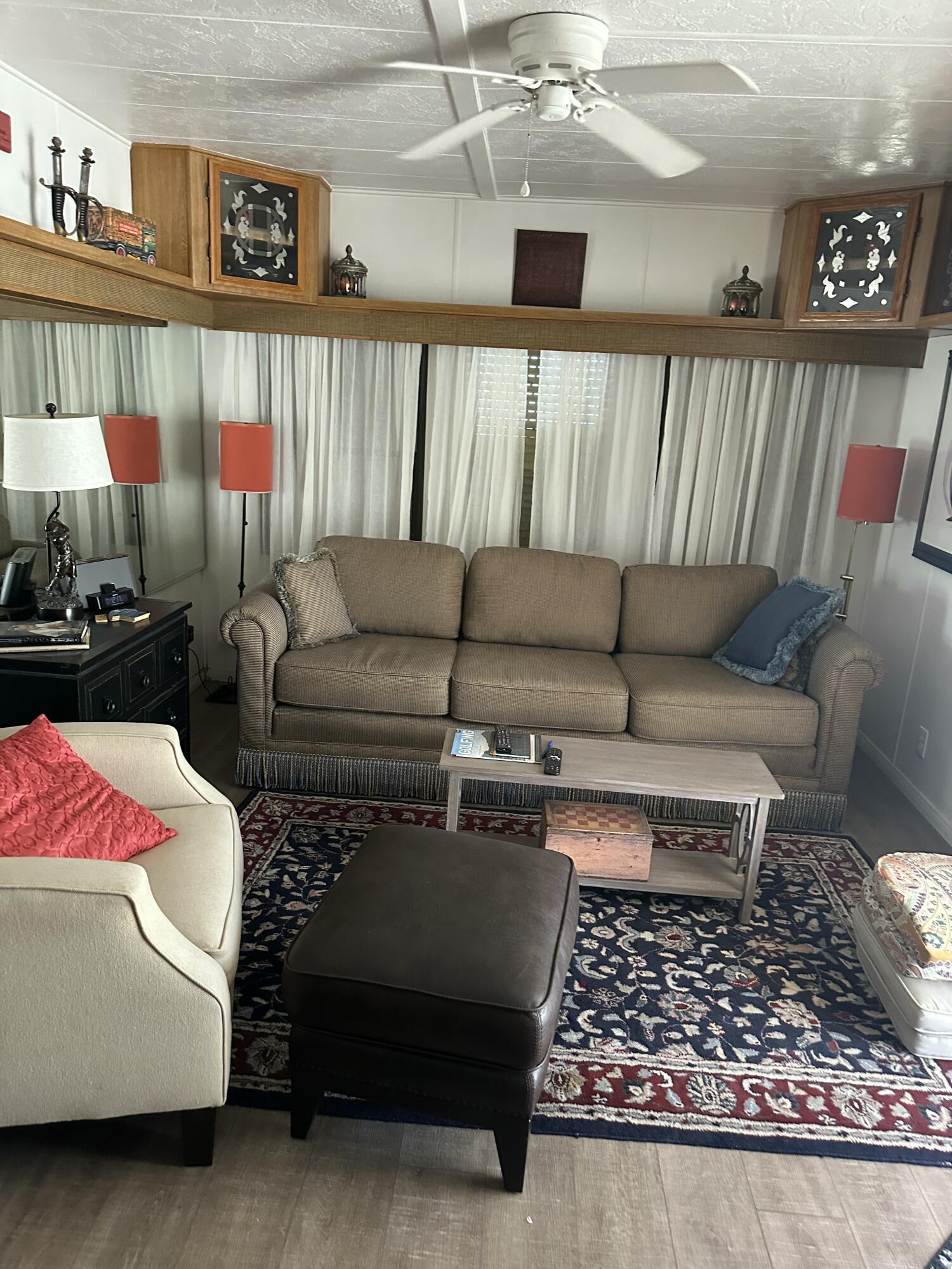 84250 Indio Springs Drive, Unit 422 Indio, CA 92203 - Photo 3 of 23 a living room with furniture a rug and a flat screen tv