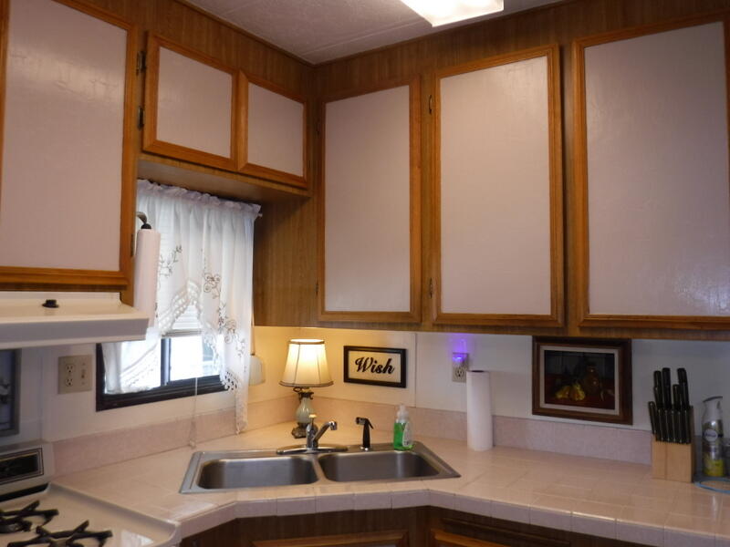 84250 Indio Springs Drive, Unit 422 Indio, CA 92203 - Photo 7 of 23 a kitchen with stainless steel appliances granite countertop a sink and cabinets