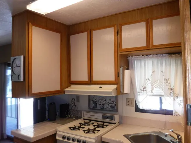 a bathroom with a sink a mirror and a window