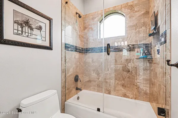 a bathroom with a toilet a sink and bathtub