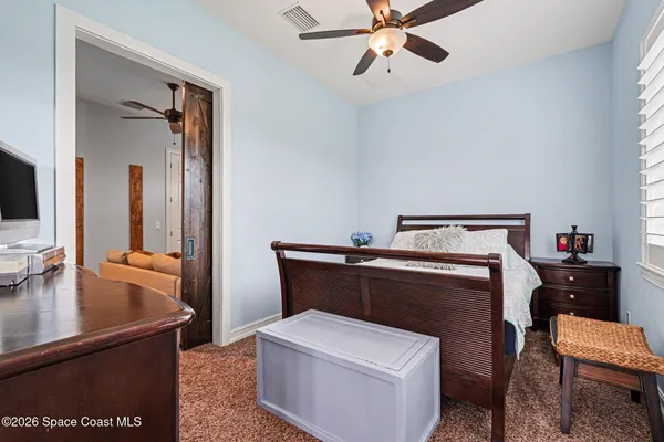 a living room with a couch and a flat screen tv