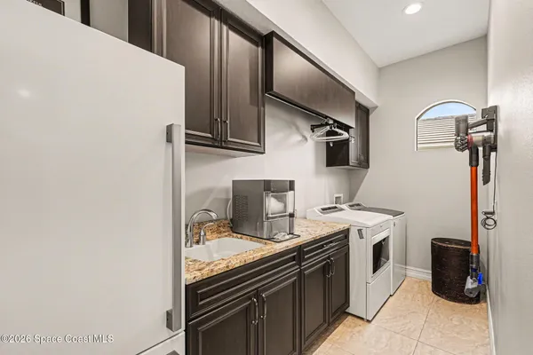 a kitchen with stainless steel appliances a stove microwave and sink