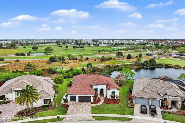 a view of a lake with a house in the background