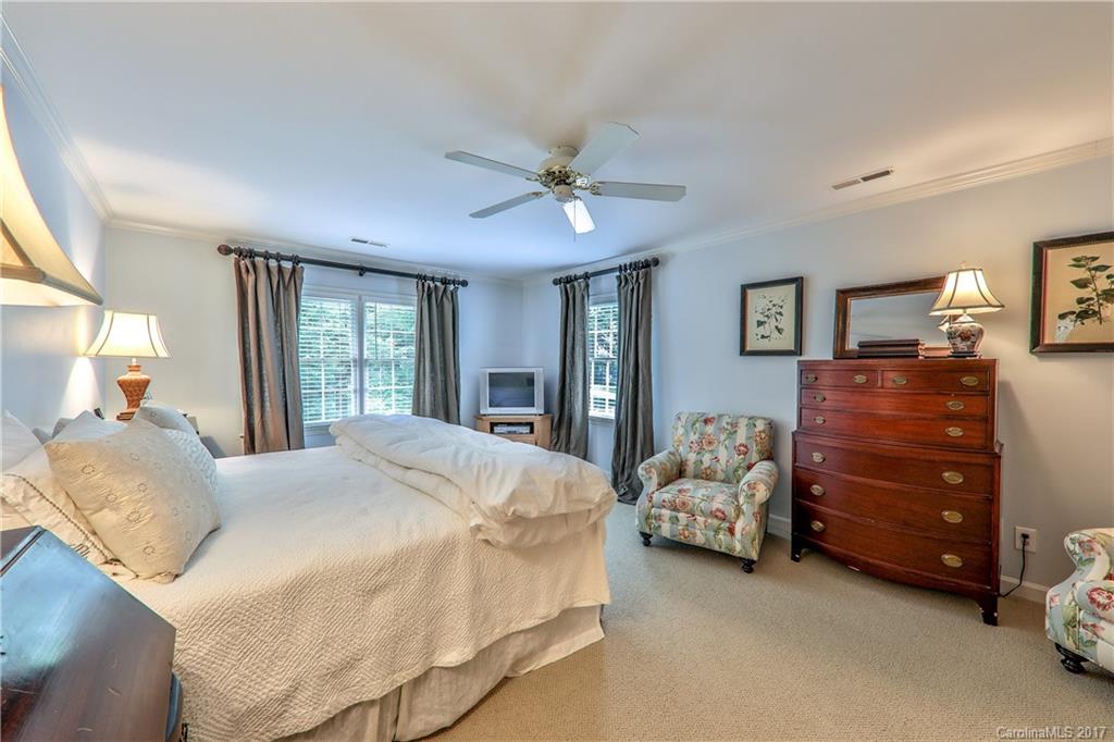 3214 Colony Road Charlotte, NC 28211 - Photo 13 of 24 a bedroom with a bed and a chandelier