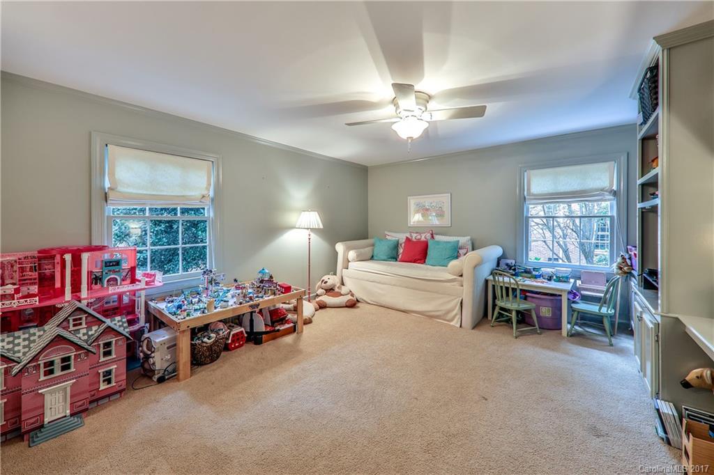 3214 Colony Road Charlotte, NC 28211 - Photo 19 of 24 a living room with furniture toys and a window