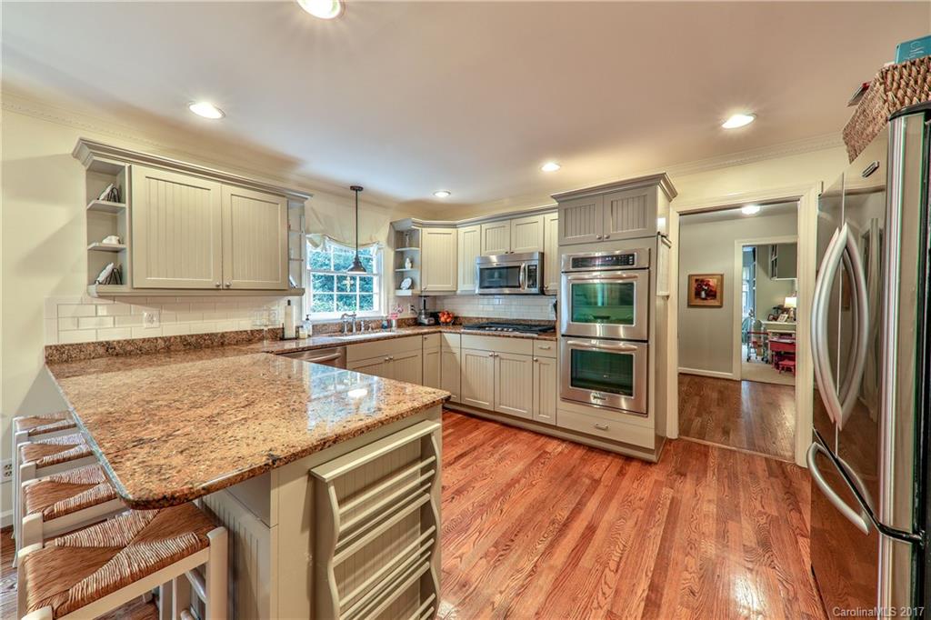 3214 Colony Road Charlotte, NC 28211 - Photo 10 of 24 a kitchen with stainless steel appliances granite countertop a refrigerator and a stove top oven