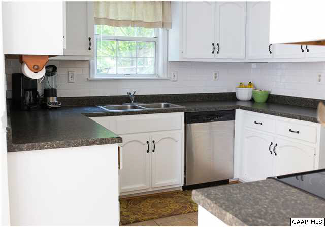 800 Harris Road Charlottesville, VA 22902 - Photo 8 of 26 a kitchen with a sink refrigerator and cabinets