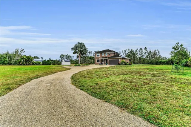 a dining room with furniture and a mirror