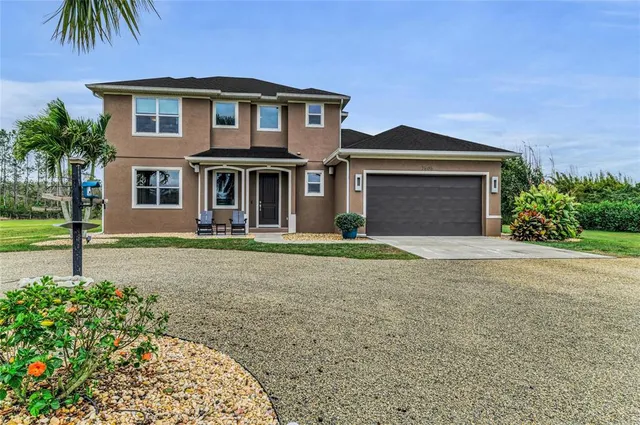 a dining room with furniture a window and a chandelier
