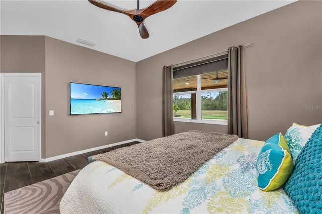 a bathroom with a granite countertop sink toilet a mirror a vanity and shower