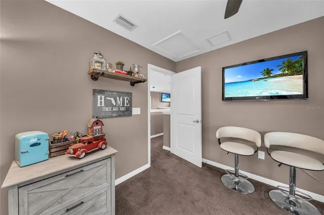 a view of a lake with houses in the back