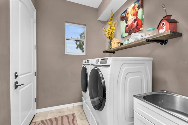 a view of a big yard with plants and large trees