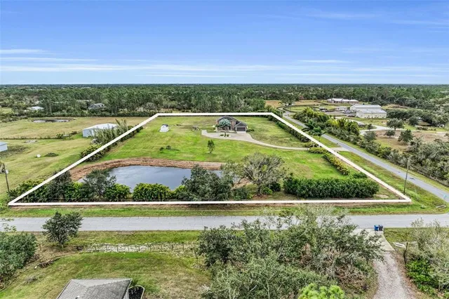 a view of a yard with a swimming pool