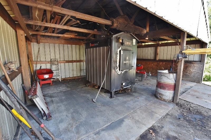 5007 Raven Road Southeast Carrollton, OH 44615 - Photo 37 of 50 A new wood boiler system is installed and can heat the house, the 5 bay garage as well as the finished garage closest to the house.