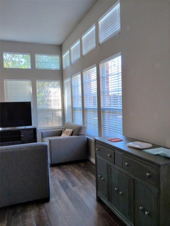 1848 Sandpiper Lane Carrollton, TX 75007 - Photo 5 of 8 Living area with dark wood-style floors and baseboards