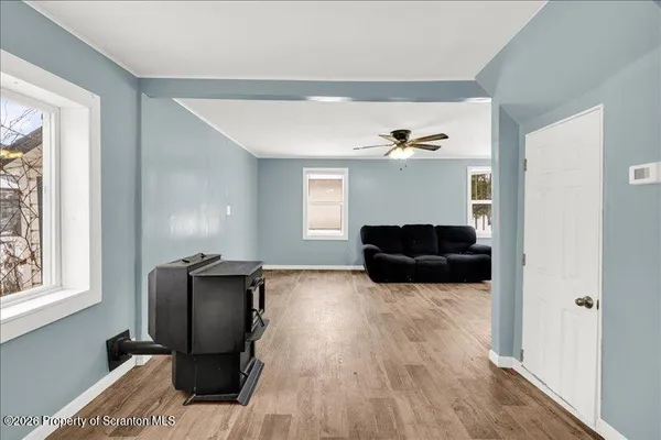a living room with furniture and a window