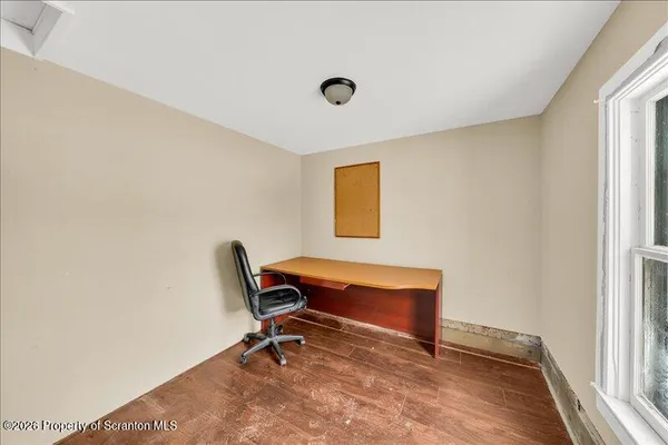 a view of a workspace with furniture