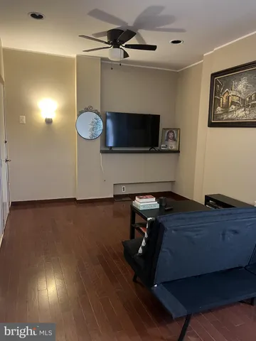 a room with furniture and a flat screen tv