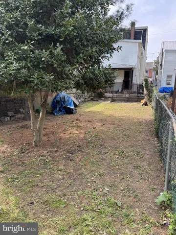 a view of outdoor space with deck and yard