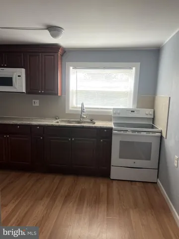 a kitchen with a sink and a stove
