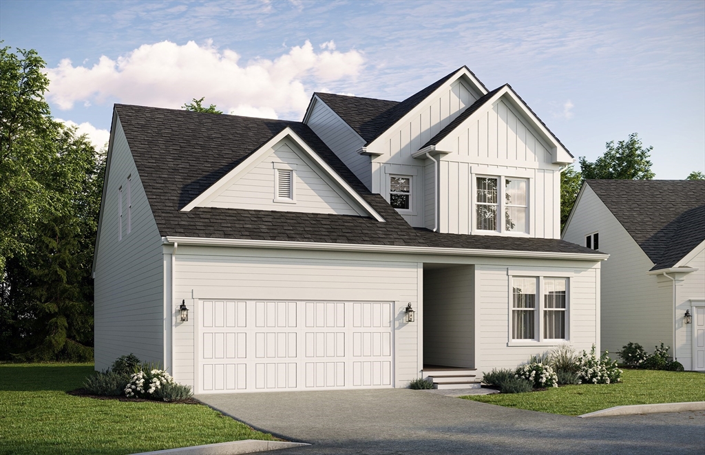 12 Tiger Terrace, Unit 28 Walpole, MA 02081 - Photo 1 of 14 a front view of a house with a yard