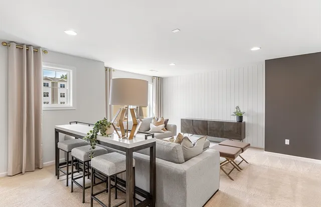 a view of a livingroom with furniture and a potted plant
