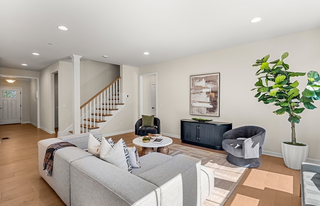 12 Tiger Terrace, Unit 28 Walpole, MA 02081 - Photo 6 of 14 a living room with furniture and a potted plant