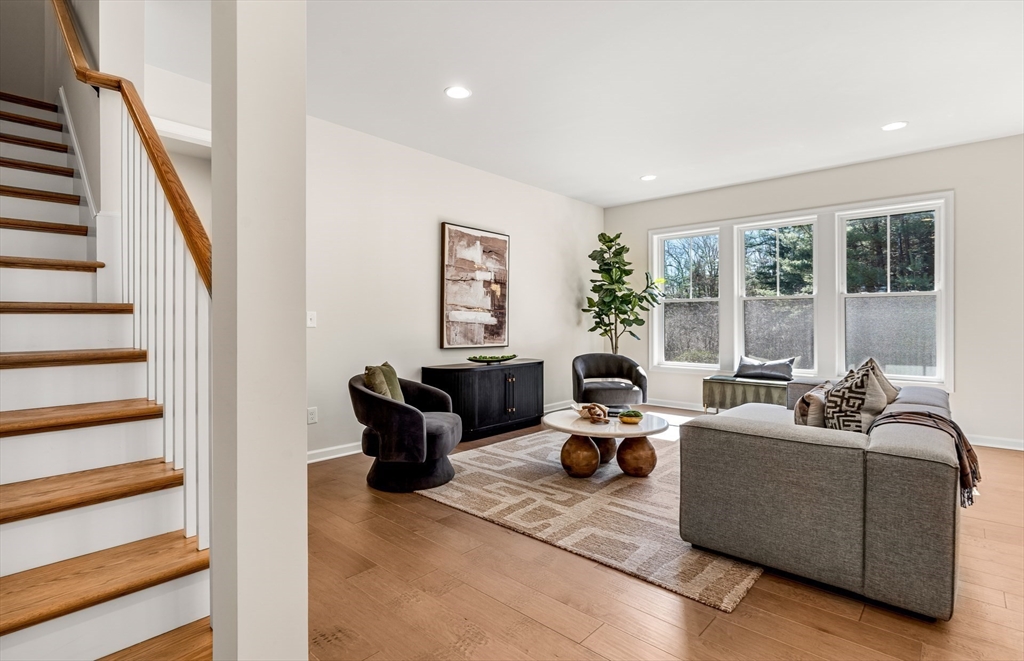 12 Tiger Terrace, Unit 28 Walpole, MA 02081 - Photo 7 of 14 a living room with furniture and a large window