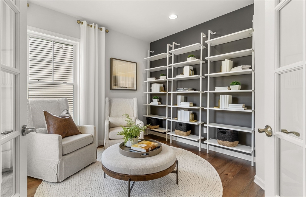 12 Tiger Terrace, Unit 28 Walpole, MA 02081 - Photo 9 of 14 a living room with furniture and a wooden floor