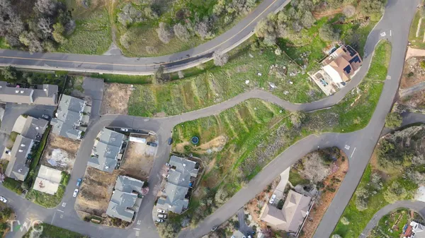 an aerial view of residential house and outdoor space