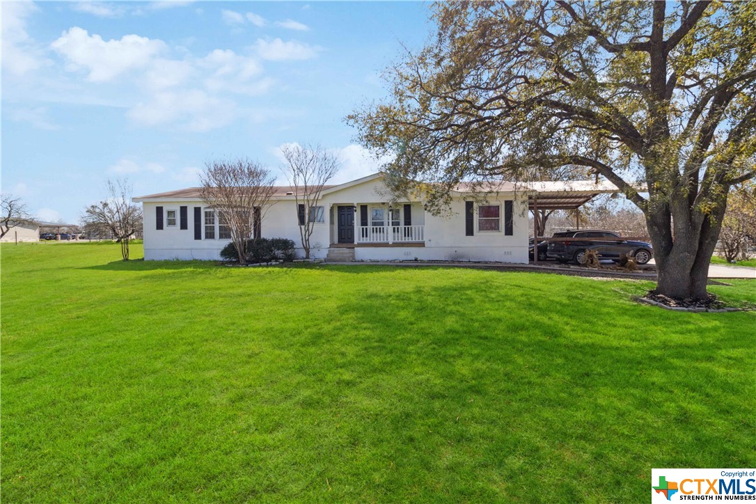 3944 Farm To Market 466 Seguin, TX 78155 - Photo 1 of 1 a view of a house next to a big yard and large trees