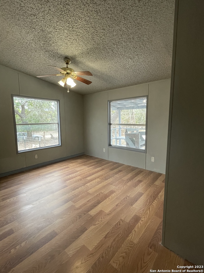 125 Pecan Drive Spring Branch, TX 78070 - Photo 10 of 12 a view of an empty room with a window