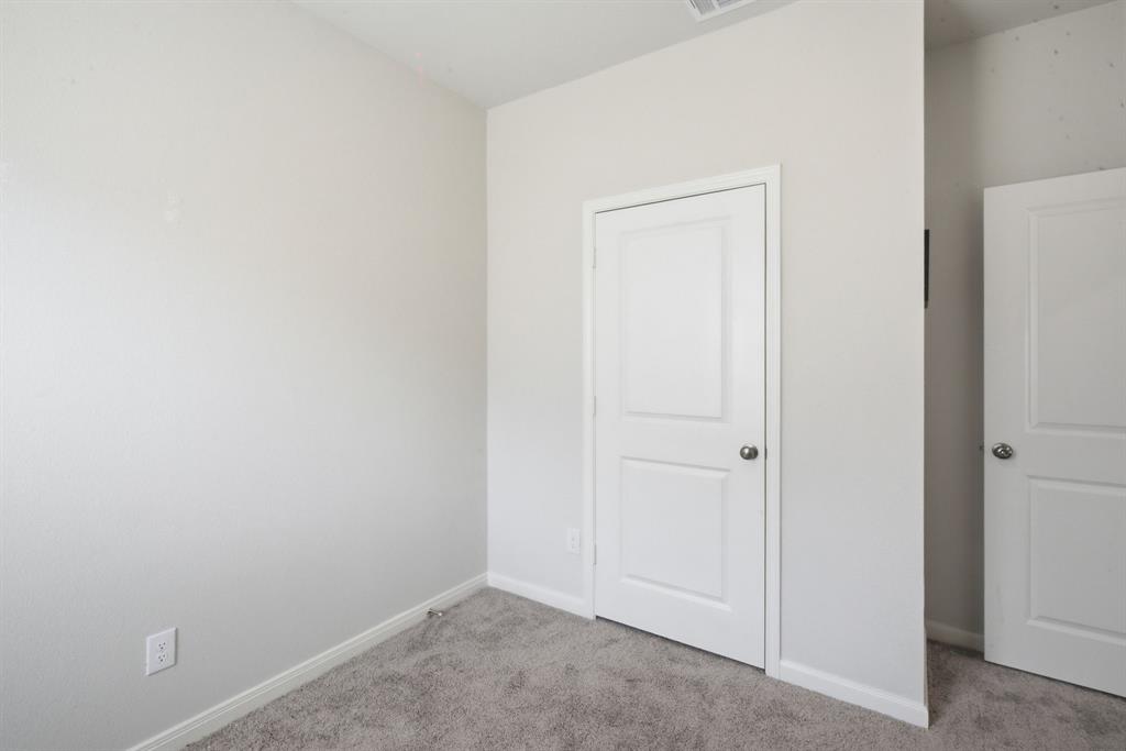 417 Jameson Springtown, TX 76082 - Photo 7 of 25 Neutral wall paint complemented by two-panel interior doors with chrome hardware