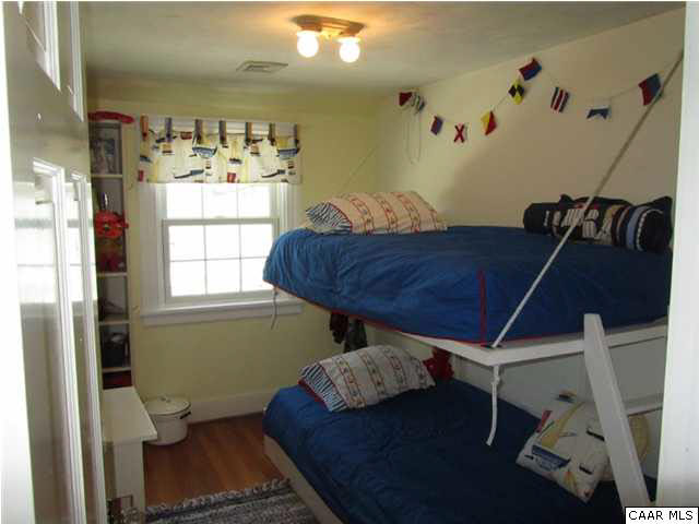 664 Horseshoe Bend Road Deltaville, VA 23043 - Photo 12 of 12 a living room with furniture and a window