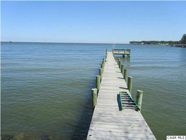 664 Horseshoe Bend Road Deltaville, VA 23043 - Photo 2 of 12 a view of wooden floor with a lake
