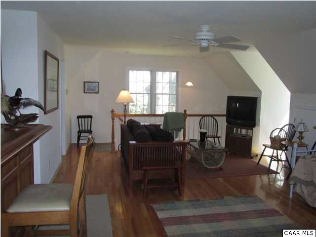 664 Horseshoe Bend Road Deltaville, VA 23043 - Photo 5 of 12 a view of a dining room with furniture and wooden floor