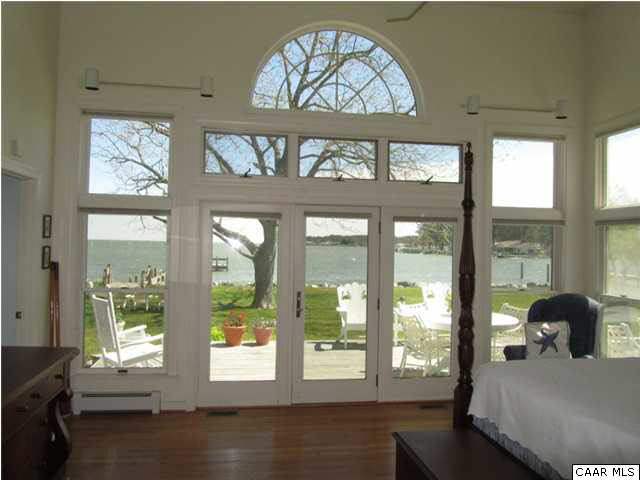 664 Horseshoe Bend Road Deltaville, VA 23043 - Photo 8 of 12 a view of a living room and a large window
