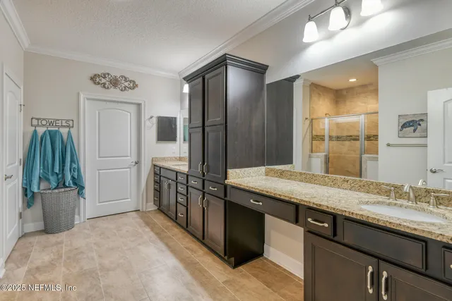 a bathroom with a glass shower door