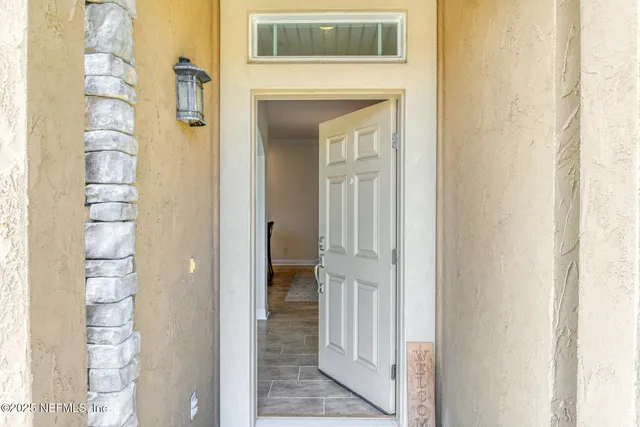 a view of a kitchen with furniture and windows