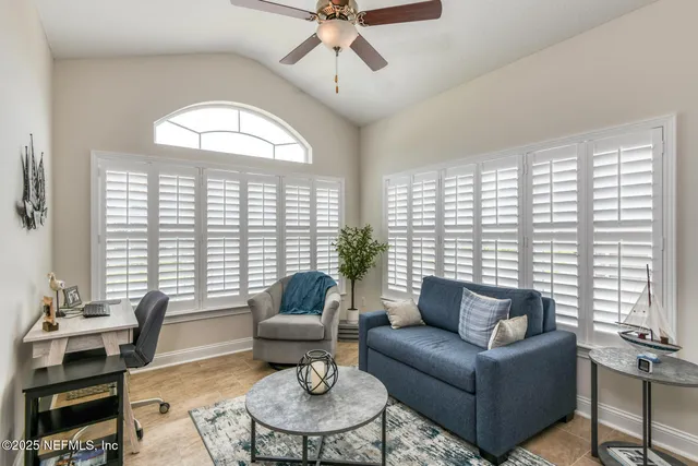 a view of a livingroom with furniture and closet