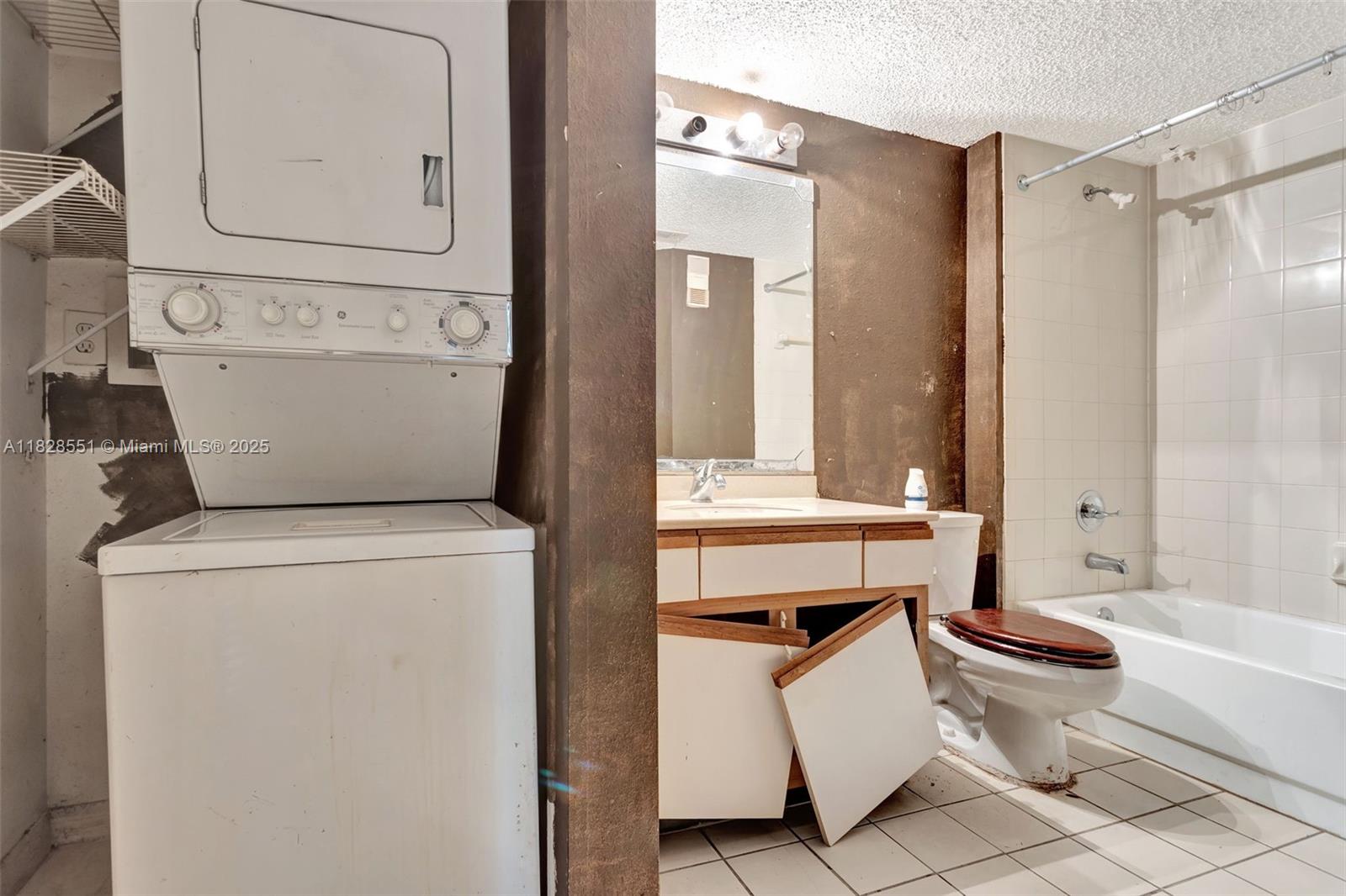 4055 West McNab Road, Unit H103 Pompano Beach, FL 33069 - Photo 12 of 21 a bathroom with a sink toilet and shower