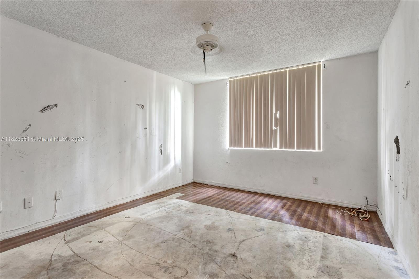 4055 West McNab Road, Unit H103 Pompano Beach, FL 33069 - Photo 13 of 21 a view of an empty room with a window